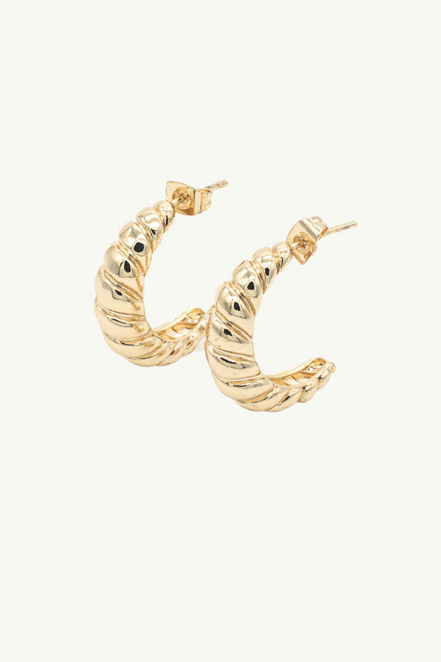 
                  
                    Croissant shaped gold hoops
                  
                