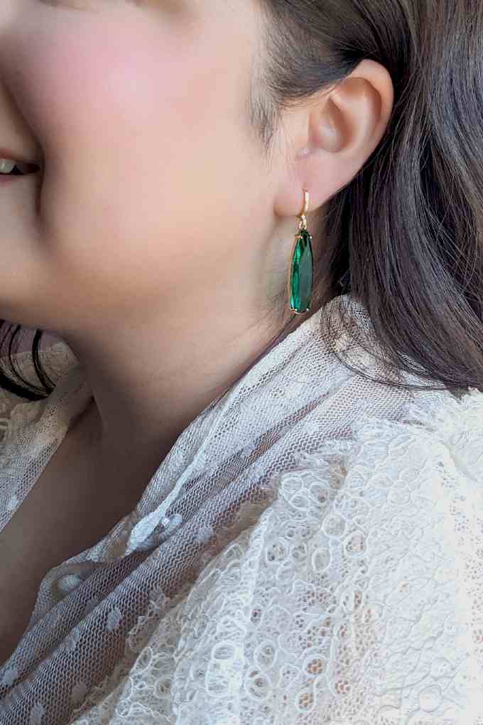 Load image into Gallery viewer, Green and gold teardrop earrings  on a model
