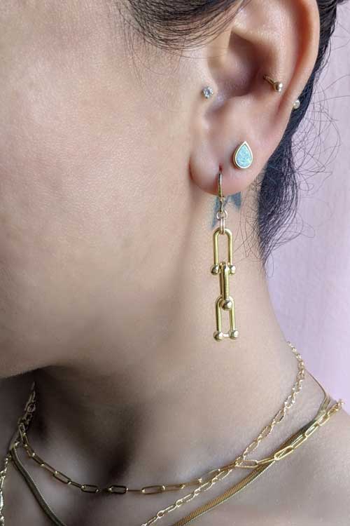 Gold chunky designer earrings. Designer jewelry by Lavender Skyline