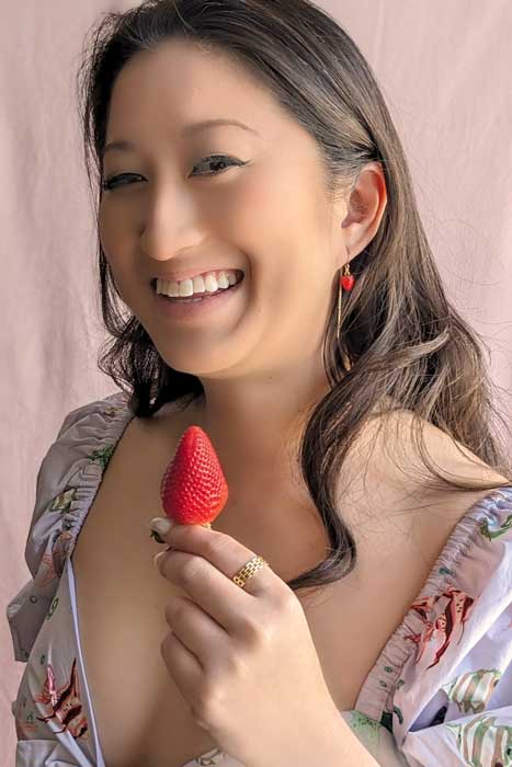 girl wearing strawberry earrings 
