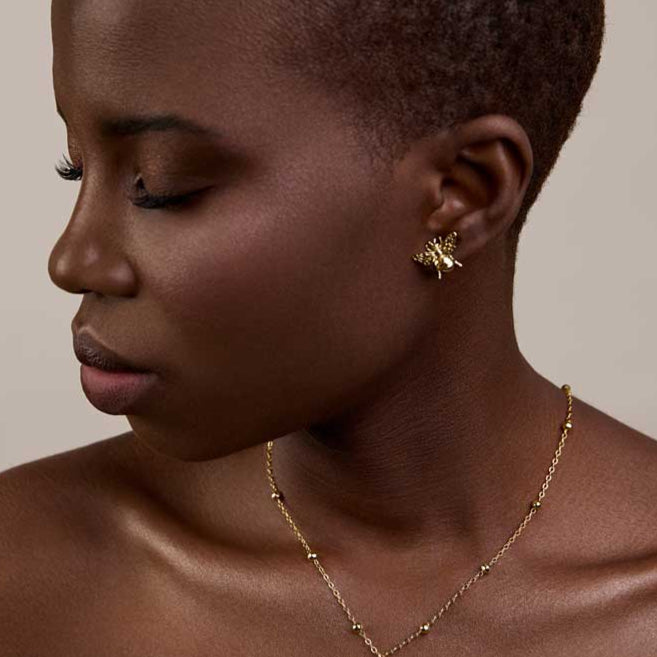 
                  
                    gold everyday bee earrings and stacking chains 
                  
                