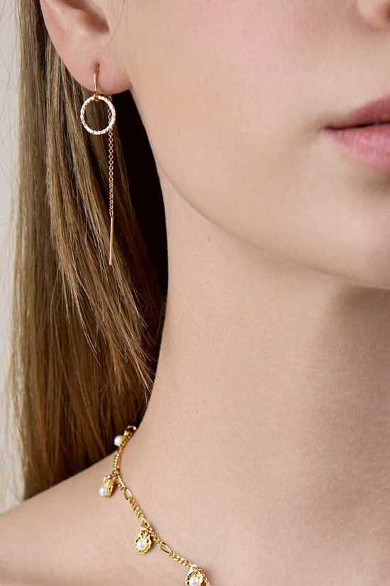Girl's half face showing circle threader earrings