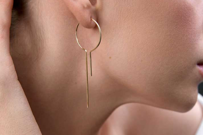 
                  
                    Girl showing medium size threader hoops
                  
                