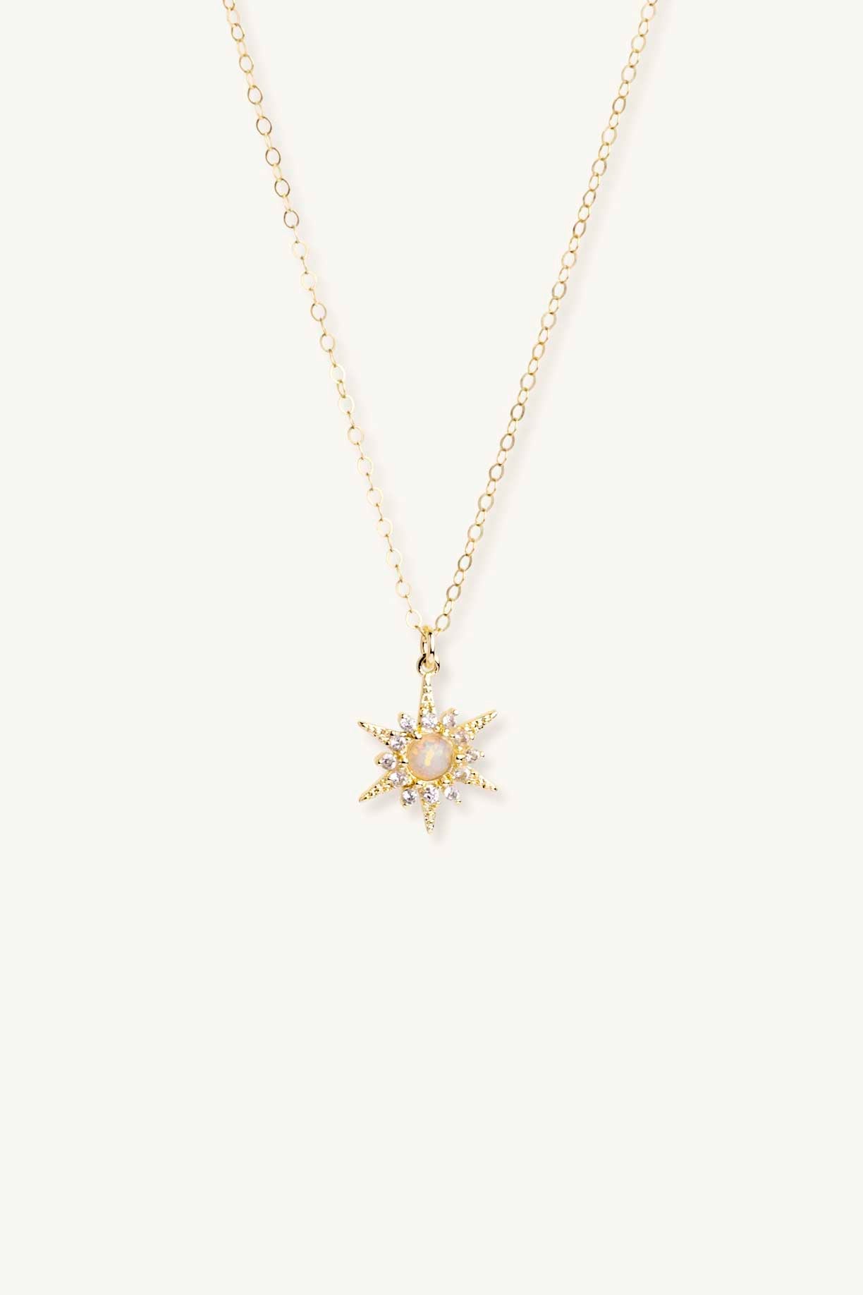 White opal sunburst gold pendant necklace