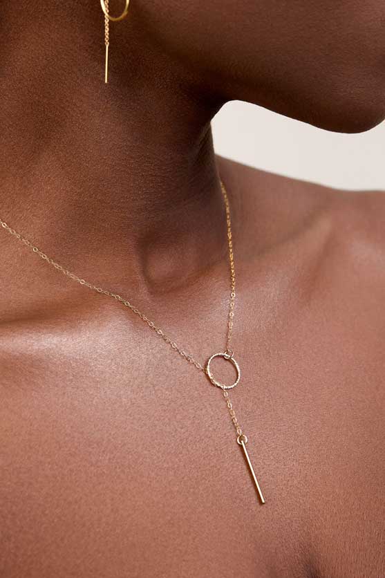 
                  
                    Model wearing a lariat necklace
                  
                