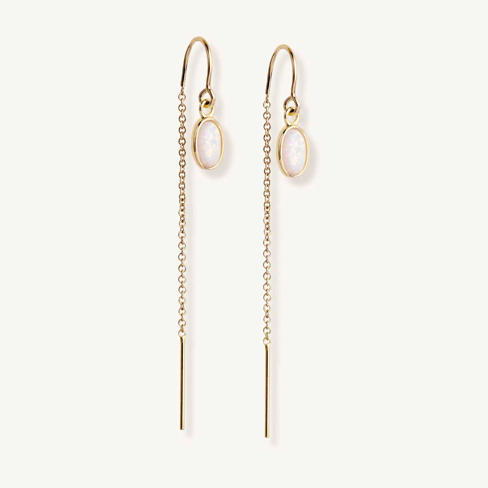 
                  
                    dainty gold earring with opals. Lavender Skyline's luxury opal jewelry 
                  
                
